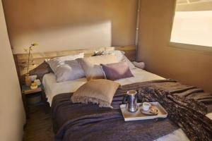 En eller flere senge i et værelse på Camping Pré-Fixe + 40 billeder