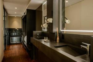a bathroom with a counter and a sink at Casa Valduga Pousada Boutique in Bento Gonçalves +46 photos