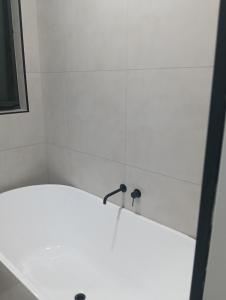 Koupelna v ubytování Mickelham beauty + 3 fotografie