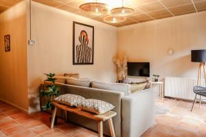 a living room with a couch and a table at Cityloft centrum Breda met privé tuin VP092 in Breda