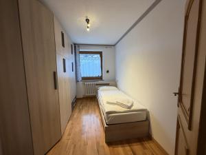 Un pat sau paturi într-o cameră la Appartamento Star Begn - Piano Terra +1 fotografie