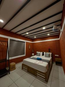 a bedroom with a large bed in a room at Rockviewstay in Kalpetta