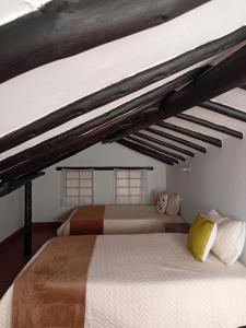 En eller flere senge i et værelse på Aparta Hotel Eucalyptus