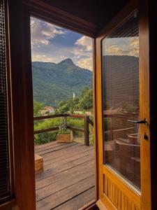 a door to a balcony with a view of a mountain at Villa Alpi in Nižepole