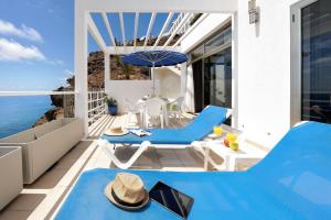a villa with a private plunge pool on a balcony at Bahia Blanca in Puerto Rico de Gran Canaria