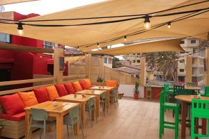 a row of tables and chairs on a patio at La Cabane du Pêcheur Atlantic Evasion in Dakar