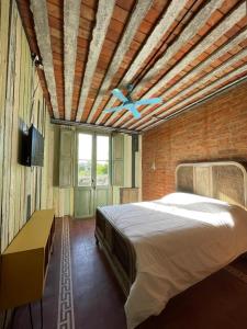 En eller flere senge i et værelse på El Granero Apart hotel