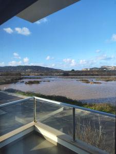 a balcony with a view of a river at Beach Hub in São Martinho do Porto