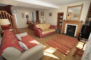 a living room with a couch and a fireplace at 2 Bed in Mumbles oc-hh120 in The Mumbles