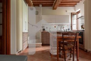 Kuchyň nebo kuchyňský kout v ubytování Homiday - Tuscany House - Parcheggio e Giardino Privato