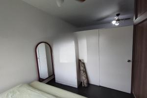 En eller flere senge i et værelse på Acomodação Tranquila