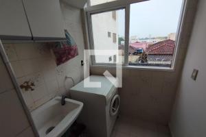 Et badeværelse på Acomodação Tranquila