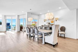 a dining room with a table and chairs at Viridian 201 in Santa Rosa Beach