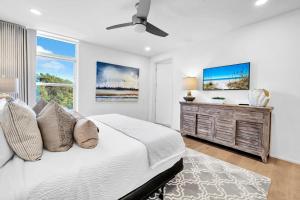 a white bedroom with a bed and a window at Viridian 201 in Santa Rosa Beach +55 photos