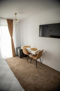 Et tv og/eller underholdning på Moment Residence