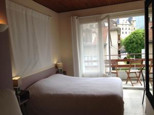 Postel nebo postele na pokoji v ubytování Hotel Sandra