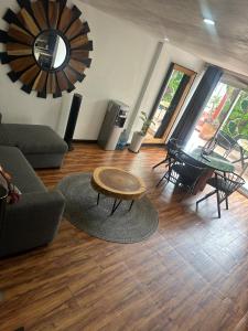 a living room with a couch and a table at La mejor ubicación Condomar 133 in Puerto Vallarta