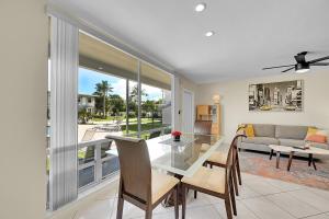 a living room with a table and a couch at Holiday Isle Yacht Club in Fort Lauderdale