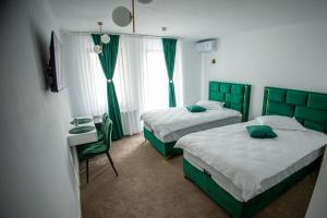 En eller flere senge i et værelse på Moment Residence