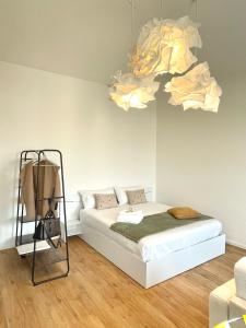 Giường trong phòng chung tại MiA MARiA MARGAUX