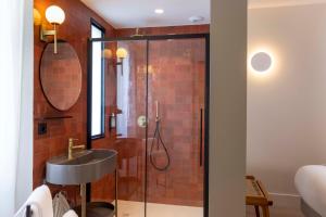 a bathroom with a shower and a sink at Ikonik Jean Médecin in Nice