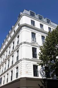 a white building with windows on the side of it at Ikonik Jean Médecin in Nice