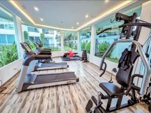 a gym with treadmills and elliptical machines at City Garden Olympus condo balcony in Pattaya South