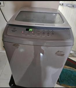 a close up of a toilet with a timer on it at Luxurious Private Room in thane only for Male in Thane