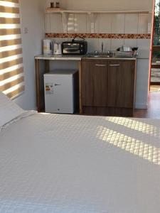 Nhà bếp/bếp nhỏ tại Palafitos Tunquén