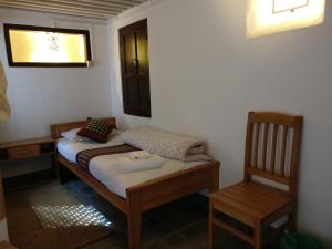 Postel nebo postele na pokoji v ubytování Hiranya Guest House