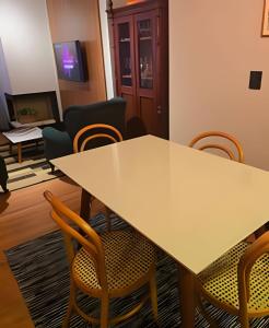 a conference room with a table and chairs at Tribeca Gramado 12 in Gramado