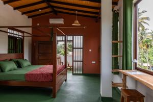 a bedroom with a bunk bed in a house at Ayana wellness resort in Talpe