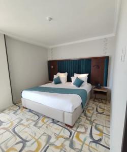 Ένα ή περισσότερα κρεβάτια σε δωμάτιο στο Hôtel Printania