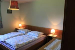 Postel nebo postele na pokoji v ubytování Haus Sigrid