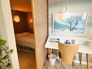 En eller flere senge i et værelse på T2 Azul - Gare et centre ville