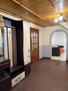 a room with a door and a living room at Floris in Myta +3 photos
