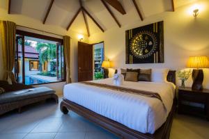 Ένα ή περισσότερα κρεβάτια σε δωμάτιο στο Baan Tawan Chai +109 φωτογραφίες