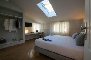 Postel nebo postele na pokoji v ubytování Villa Bellarosa