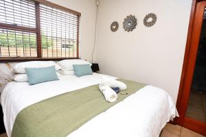 En eller flere senge i et værelse på African Oasis Zambia