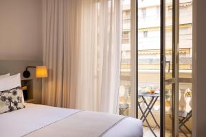 En eller flere senge i et værelse på Crisol Mozart