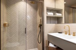 a bathroom with a shower and a sink at Crisol Mozart in Nice