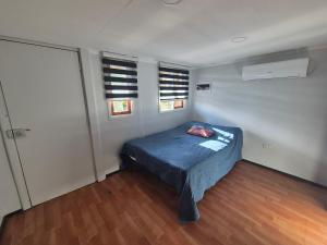 En eller flere senge i et værelse på Cabañas Friburgo