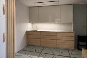 a kitchen with wooden cabinets and a sink at Séjour réussi à deux pas de Genève appartement 57m2 in Ferney-Voltaire +5 photos