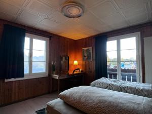 Ένα ή περισσότερα κρεβάτια σε δωμάτιο στο Apartment Thun - Lake view