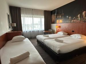 Ένα ή περισσότερα κρεβάτια σε δωμάτιο στο Westlake Hotels Amsterdam +12 φωτογραφίες
