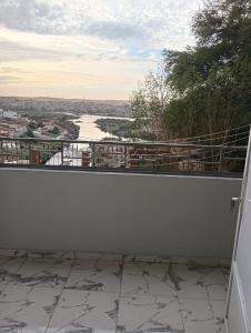 a balcony with a view of a river at noreno houseاسوان شياخة تانية طريق السادات in Aswan
