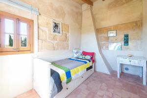 A bed or beds in a room at Sa Vinya Des Compte