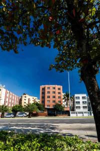 an empty street in a city with buildings at Vitoria Praia Hotel in Vitória