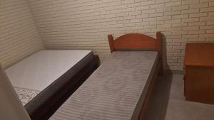 En eller flere senge i et værelse på Casa Fávero - Rua Peri