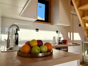 a bowl of fruit on a counter in a kitchen at Vikendica Nomadova Koliba in Tvrdimići